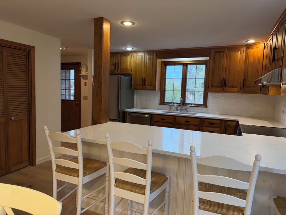 Newly renovated kitchen with breakfast bar and induction stove. 
