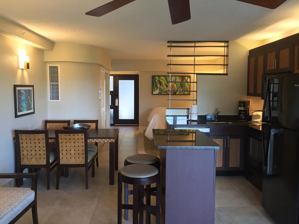 Bright studio with kitchenette, dining area, and stylish modern finishes