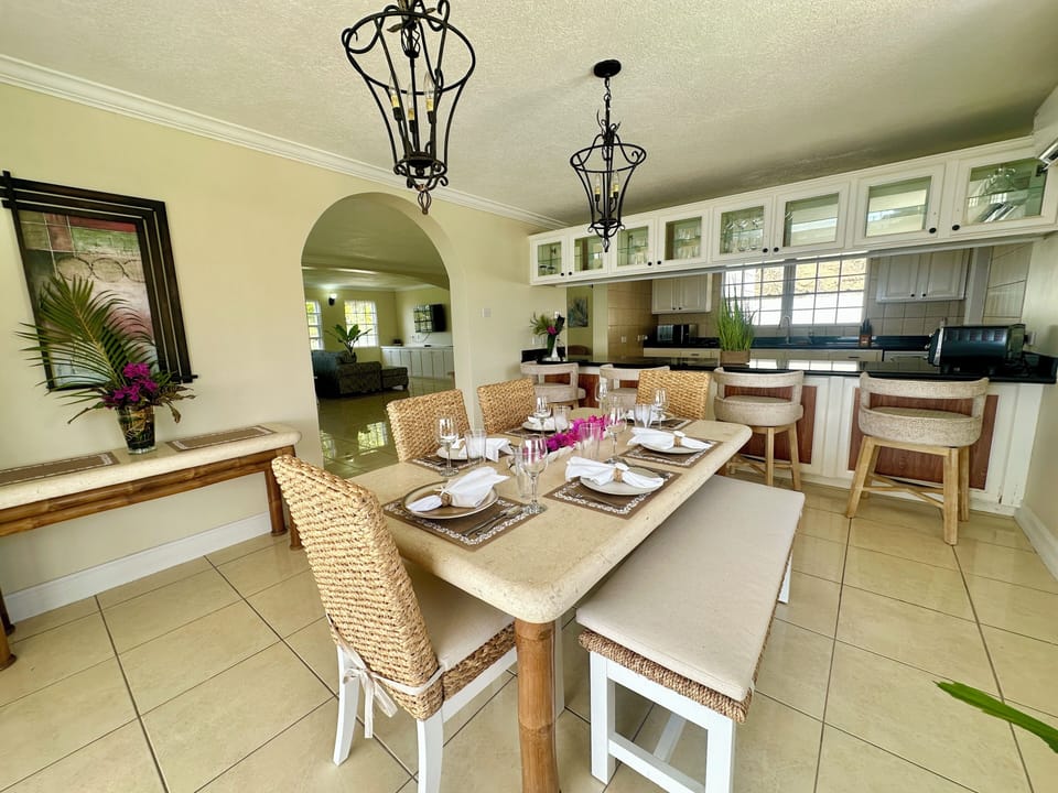 Dining table accommodates seating for up to 7 + barstool counter seating for 4.