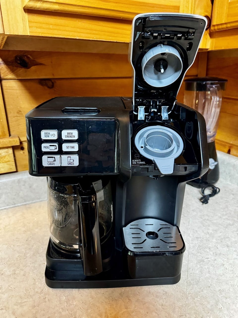 Coffee maker accepts grounds or pods