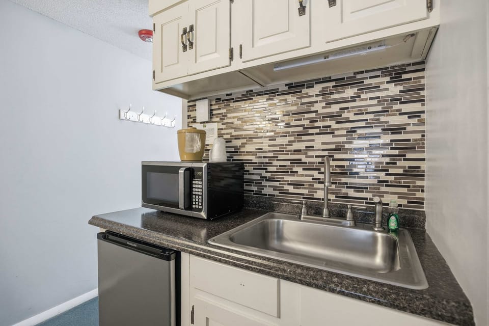 Keep drinks & snacks tucked away in the cozy kitchenette​