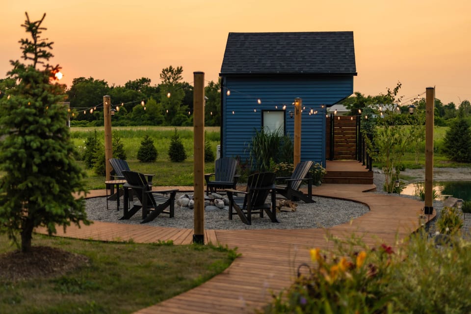 Cabin firepit adirondack chairs string lights