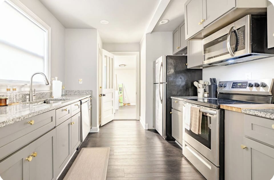 Modern kitchen, spacious for cooking and gathering, with dining views