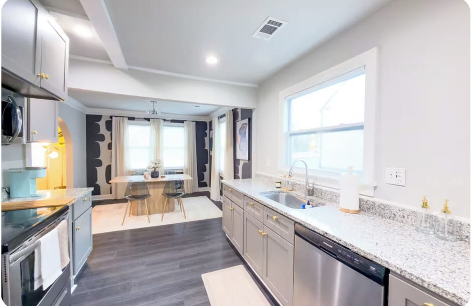 Modern kitchen, spacious for cooking and gathering, with dining views