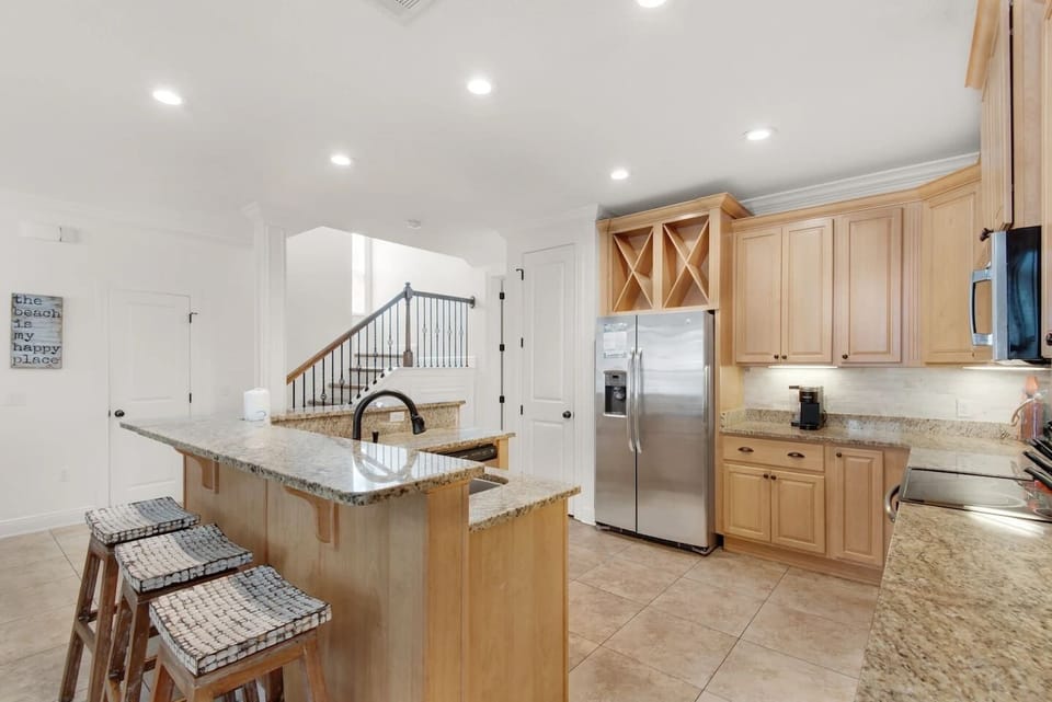 The kitchen island has bar seating, a great spot for morning coffee or keeping the cook company.