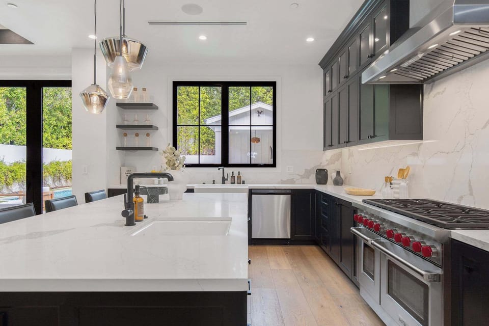 A chef-grade kitchen with commercial range, stone surfaces, and modern farmhouse detailing in West Hollywood