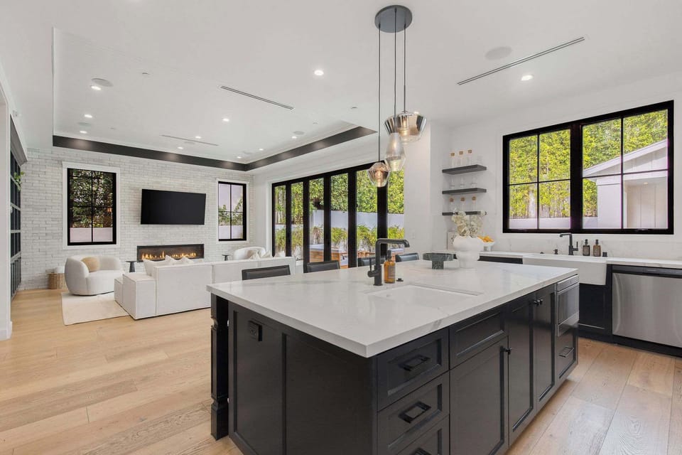 A professional-grade kitchen with dual prep areas, custom cabinetry, and luxury finishes