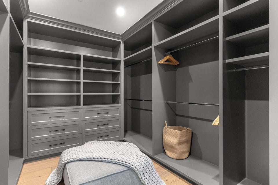 A custom walk-in closet designed for extended stays and full wardrobe storage