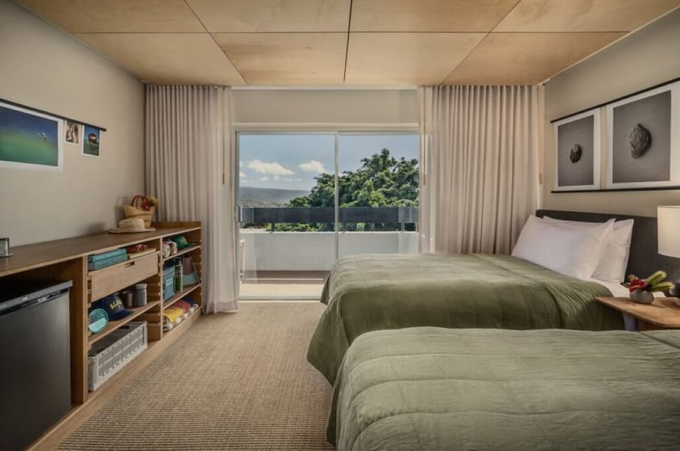 Stretch out comfortably with two beds and relaxing balcony views.