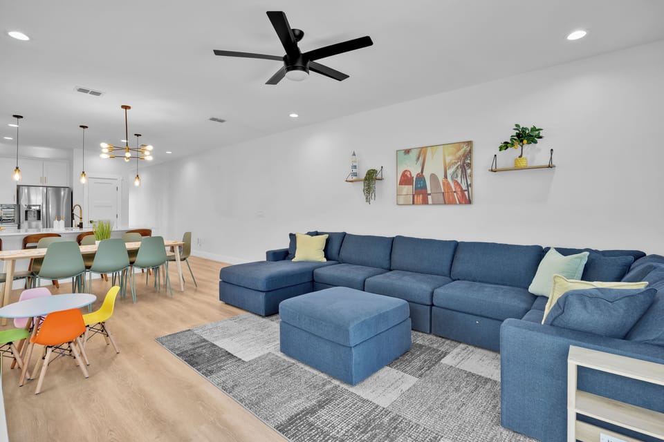 Living Room - large sectional, 75in TV, electric fireplace, board games.