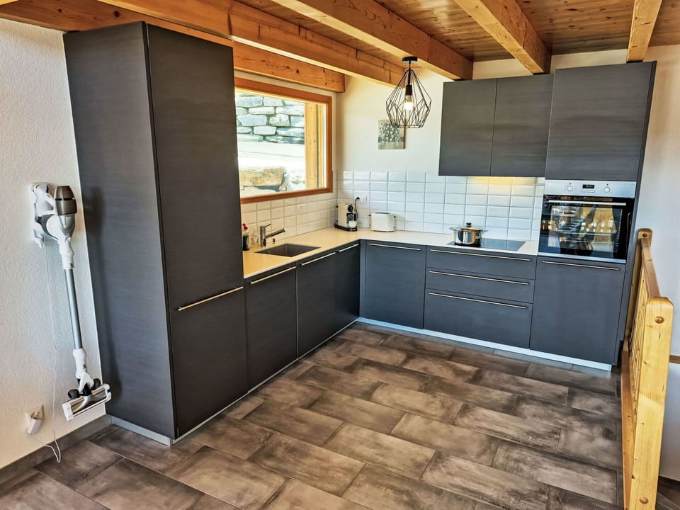 Flooring, Kitchen, Countertop, Cabinetry, Wood, Floor, Furniture, Interior Design, Kitchen Appliance, Wood Flooring