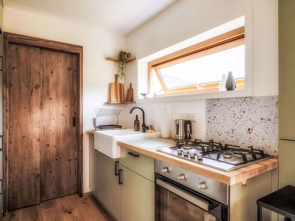 Kitchen, Countertop, Kitchen Appliance, Wood, Interior Design, Furniture, Major Appliance, Kitchen Stove, Flooring, Cabinetry
