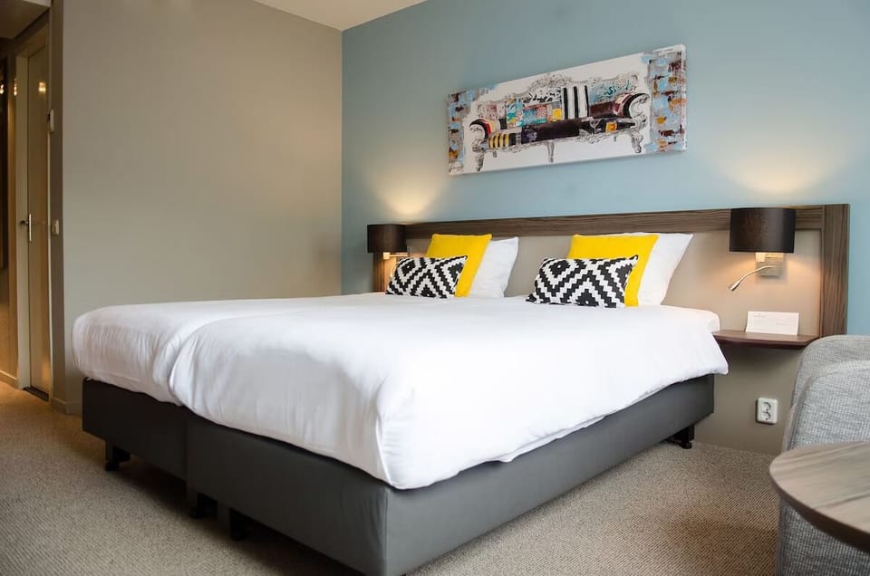 Drift off on a plush king bed with cozy lighting.