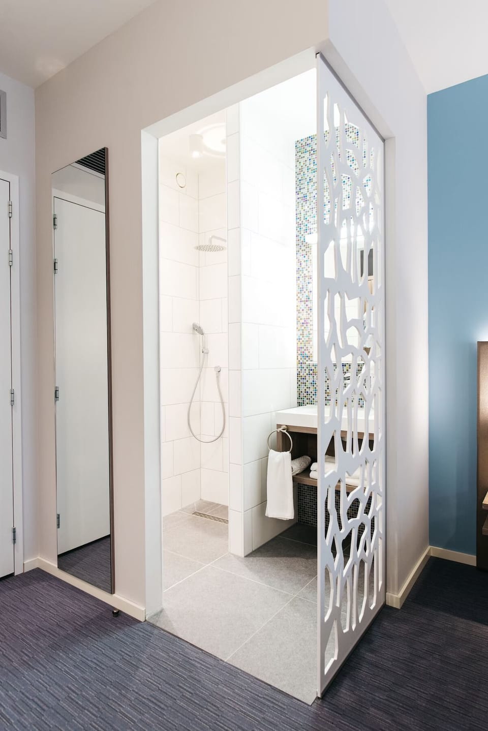 Step into a bright walk-in shower for an easy reset.