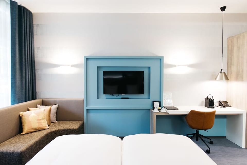 Unwind on the cozy sofa after a productive work session.