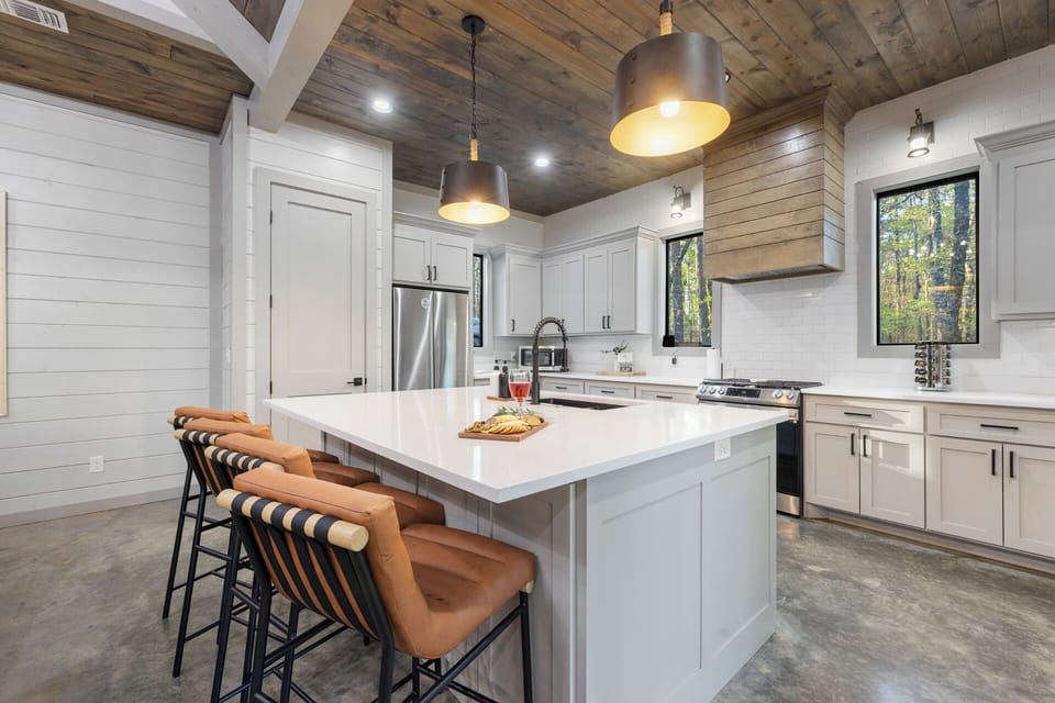 Oversized kitchen island with 4 additional seats—allowing plenty of space for prepping, serving, and chatting with the group