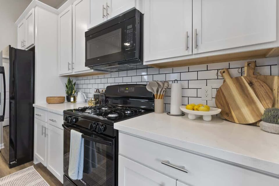 Bright chef’s kitchen with stove, microwave, and everything you need for home-cooked meals.