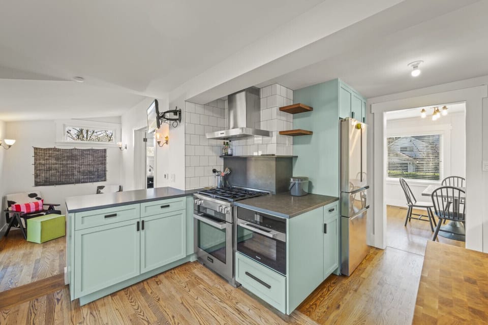 Bright and open, the kitchen flows naturally into the living and dining areas, creating an inviting setting for both gatherings and everyday living.