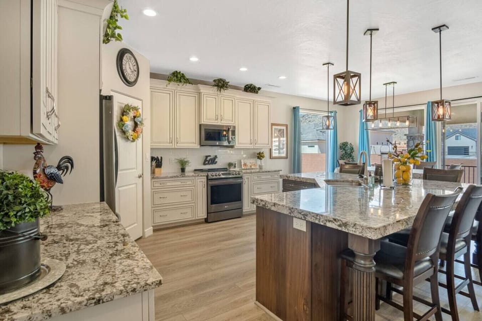 Fully Stocked Kitchen with island and stainless steel appliances