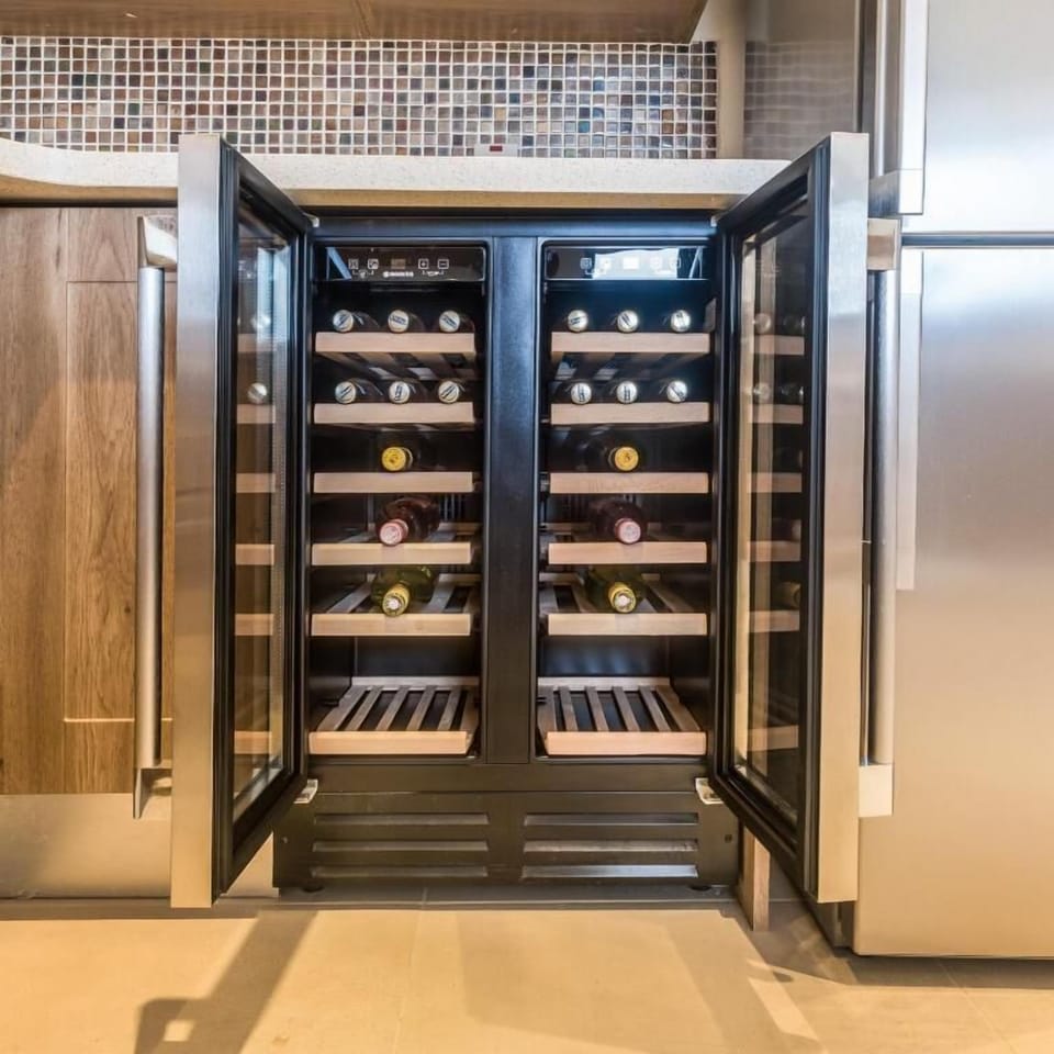 Celebrate with perfectly chilled bottles from the built-in wine fridge.