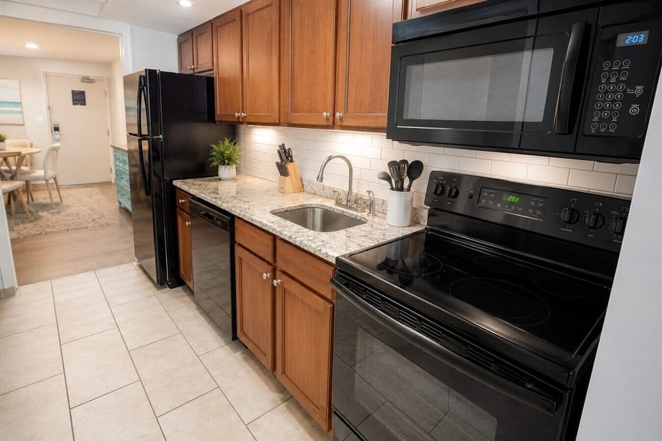 Clean, bright, and thoughtfully equipped, this modern kitchen features full-size appliances, beautiful granite countertops, and everything you need to cook, dine, and feel right at home during your stay.