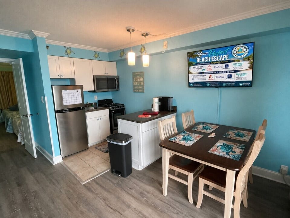 Whether you`re fueling up for a day at the beach or sharing dinner after a sunset stroll, this open-concept kitchen and dining area has everything you need. Enjoy a fully equipped kitchen, seating for four, and a Smart TV for your favorite shows while you