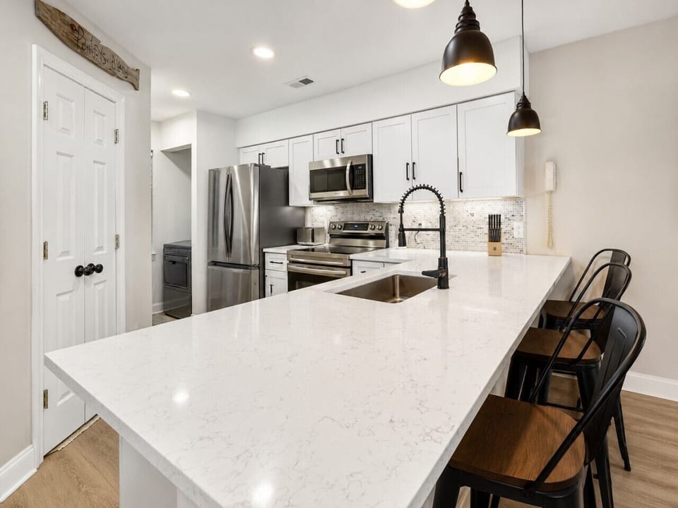 Gather around the spacious island for slow morning coffee, family breakfasts, and effortless meals after a sun-filled day exploring the coast.