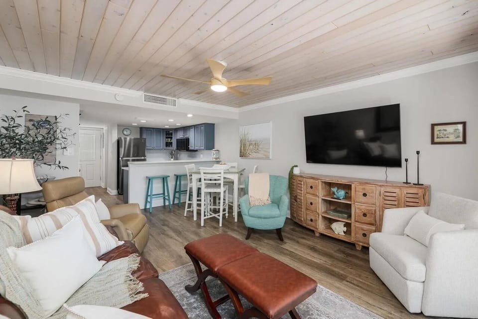 Cozy living room with open kitchen and vibrant seating