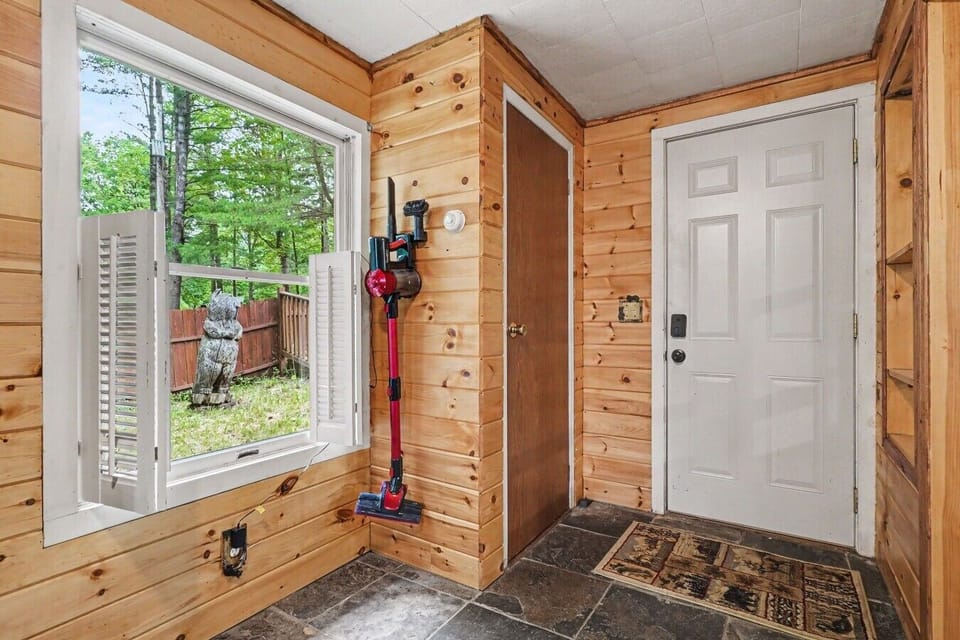 Mudroom Area | Vacuum Cleaner | Backyard Access