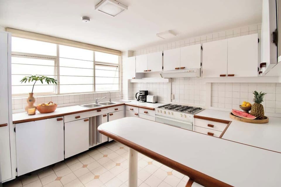 A bright and welcoming kitchen where natural light and open space make cooking feel relaxed and enjoyable.