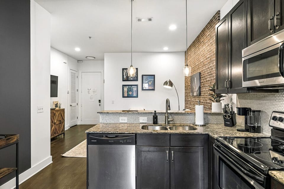 Fully equipped kitchen with stainless steel appliances, everything you`d need to make a home cooked meal