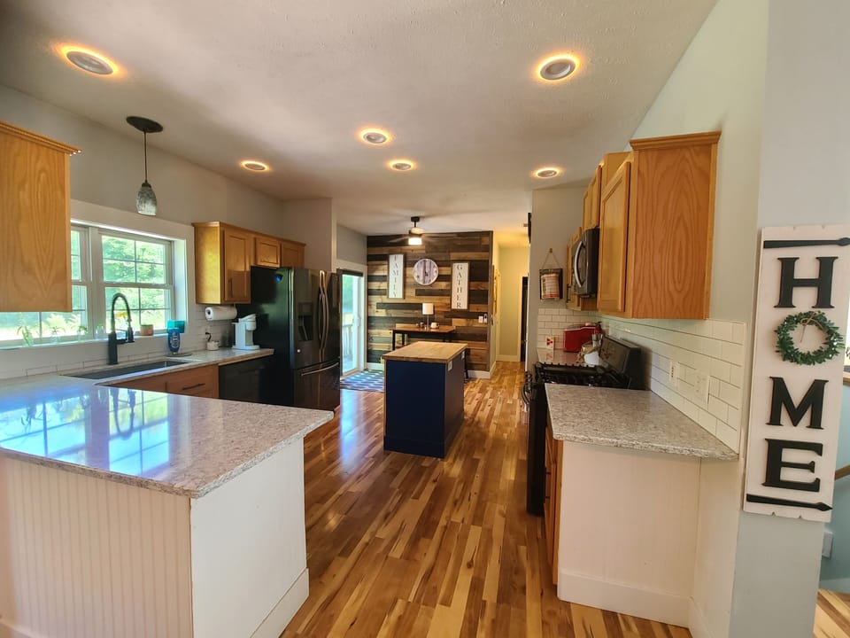 Beautiful kitchen with many amenities. 