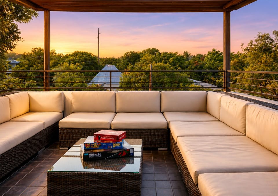 Covered rooftop lounge with sunset views and spacious sectional seating
