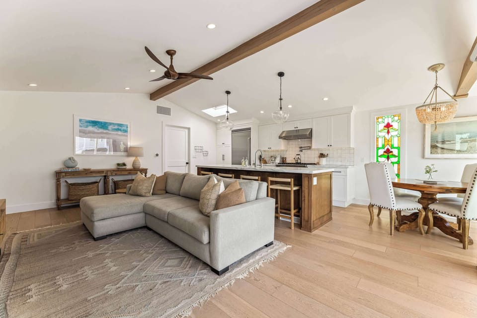 A bright, open-concept space that connects the living, dining, and kitchen areas with a natural, easy flow.