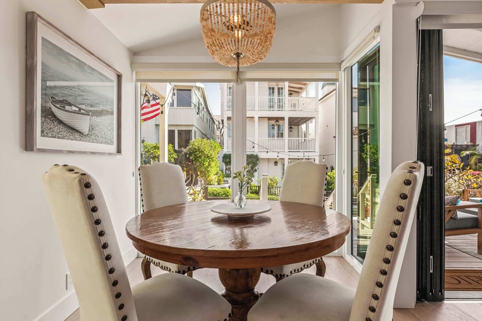 This dining space opens to the outdoors, bringing in fresh air and a bright, relaxed atmosphere for every meal.