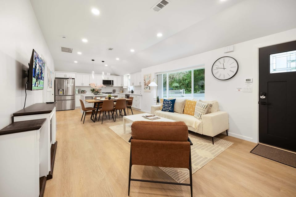 Expansive open layout with a seamless blend of living, dining, and kitchen spaces.