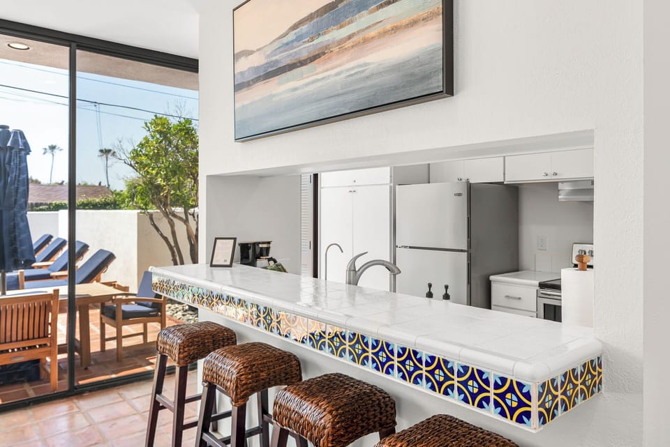 Kitchen bar with seating for easy meals and conversation.