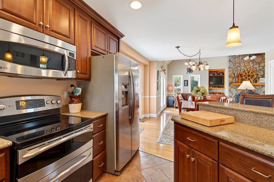 Kitchen with island seating for 2, dishwasher, and drip-style coffee maker