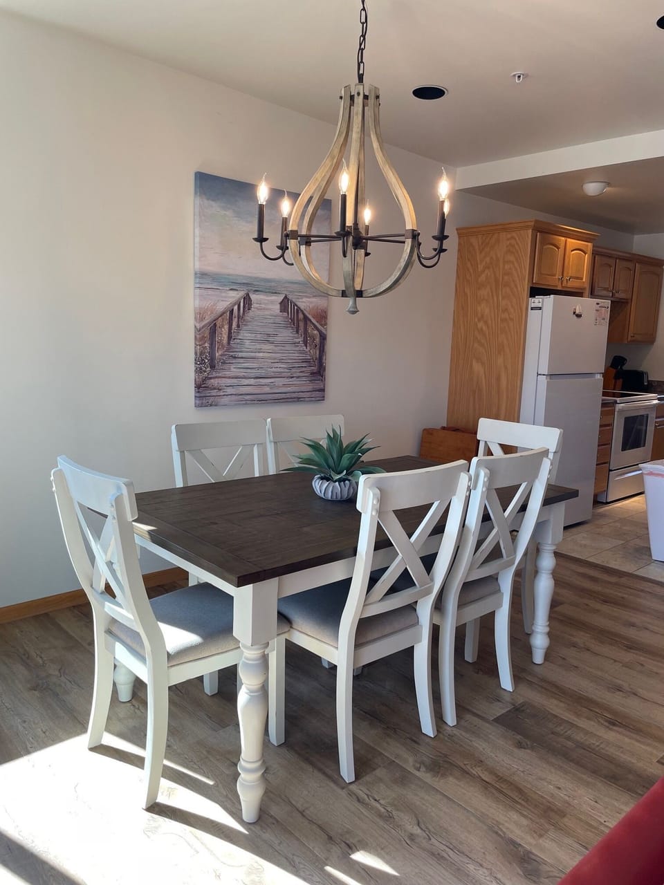 DIning area with kitchen in the background