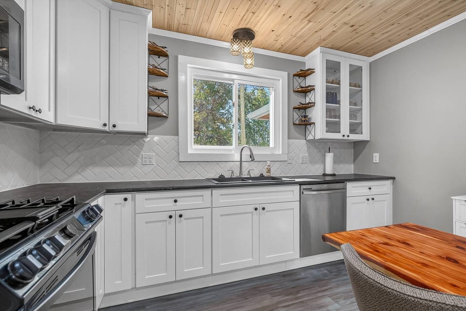 Updated kitchen with new cabinets, backsplash, and appliances
