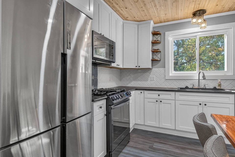 All new stainless appliances and backsplash in the kitchen
