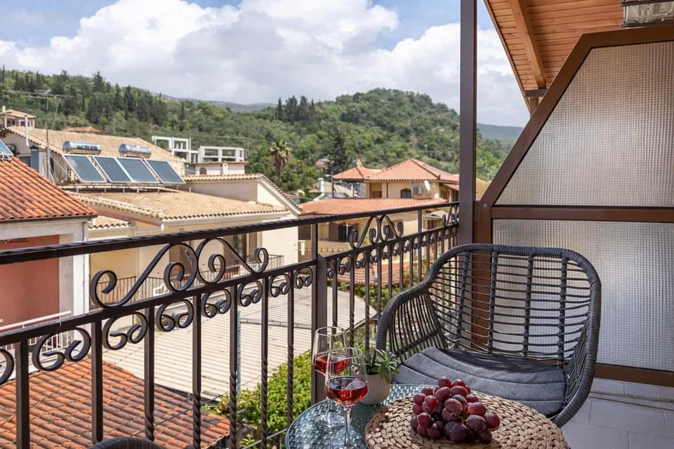 Spacious balcony with stylish mountain views and comfortable seating. A perfect place to relax, sip a drink, and enjoy the peaceful surroundings