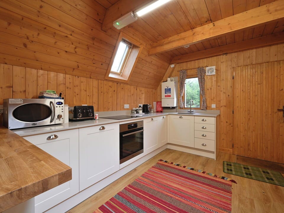 Kitchen, Wood, Flooring, Ceiling, Countertop, Floor, Major Appliance, Cabinetry, Kitchen Appliance, Interior Design