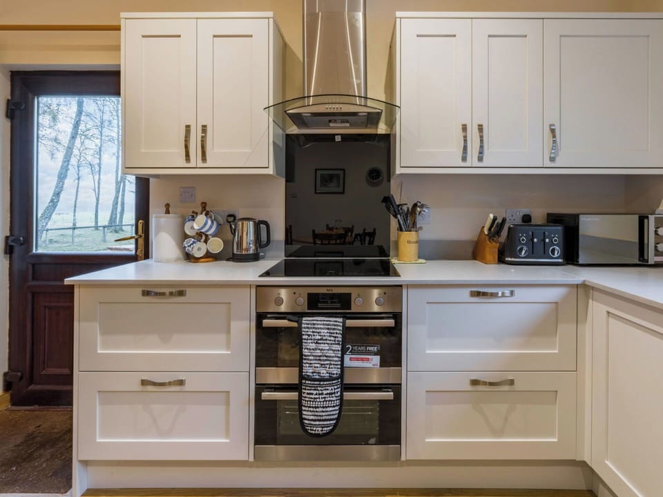 Cabinetry, Kitchen, Kitchen Appliance, Countertop, Wood, Interior Design, Major Appliance, Flooring, Furniture, Home