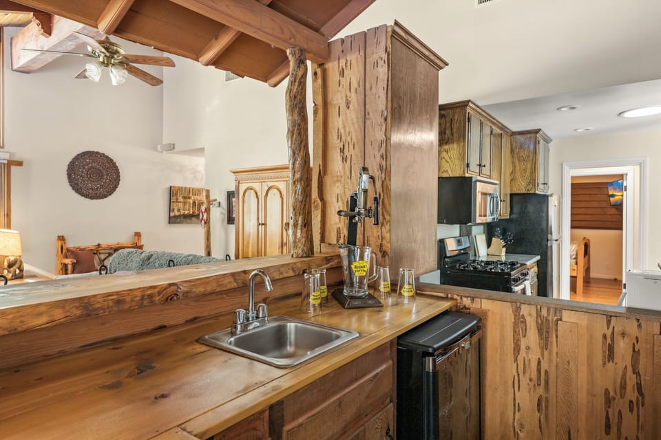 Full Kitchen - The open layout includes a full kitchen, dining area, and a bar space perfect for gathering with everything you need to cook amazing meals.