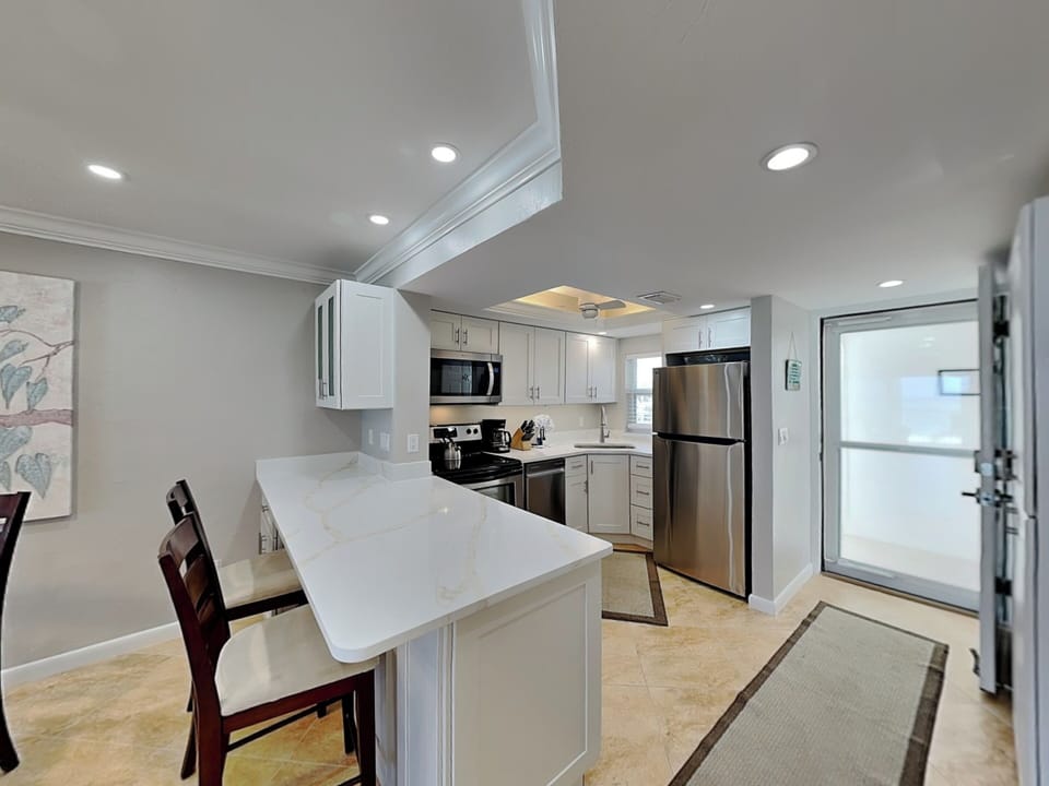 Kitchen with Stainless Steel Appliances + Breakfast Bar Seating for 2