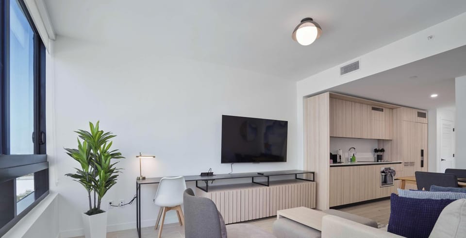 Bright open-plan living and kitchen area, ideal for unwinding after a Miami adventure