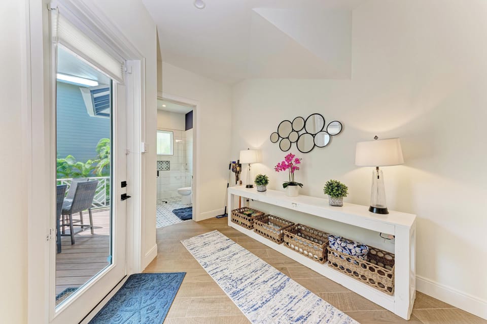 Step into your stylish entryway where elegant decor and thoughtful storage create the perfect welcome home feeling.