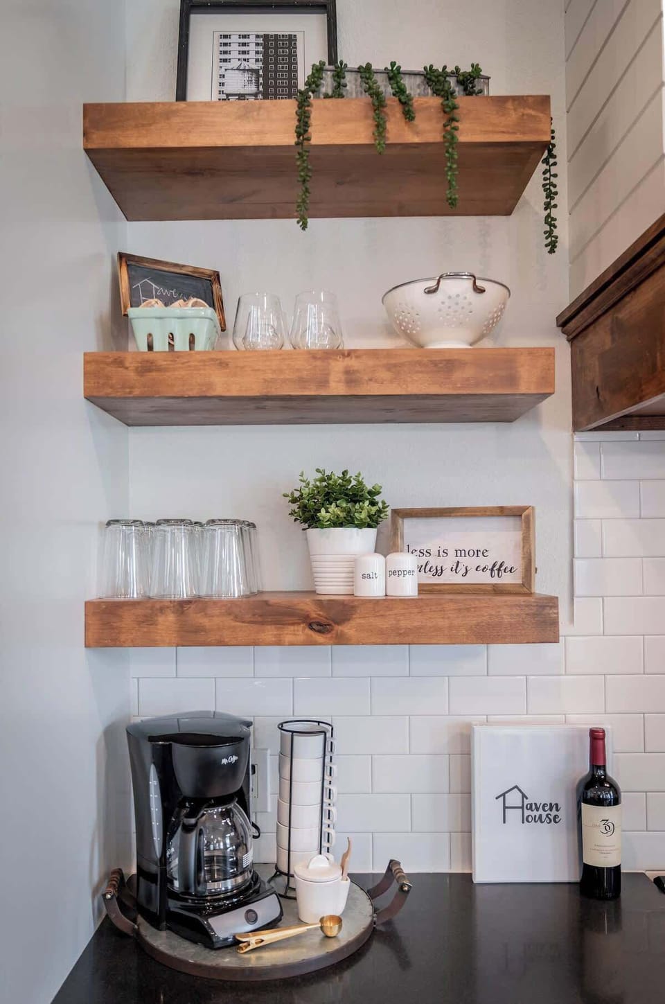 Coffee and creamer are waiting for you! (Also a bottle of Cabernet!) Our open shelving let's you see the adult dining ware or open the drawers below to find child-safe dishes.