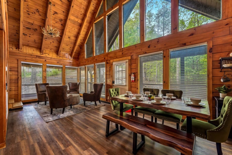Cabin 4: Spacious living room with comfortable seating, TV, and a cozy lounge area.